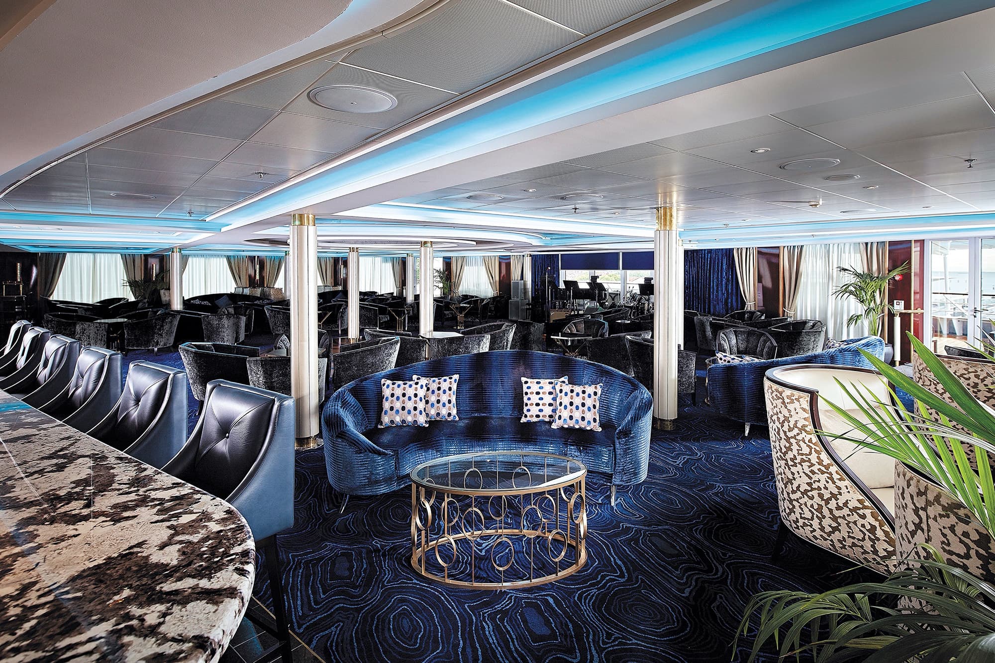 Aurelia Lounge aboard Lumina, with curved seating arranged for conversation